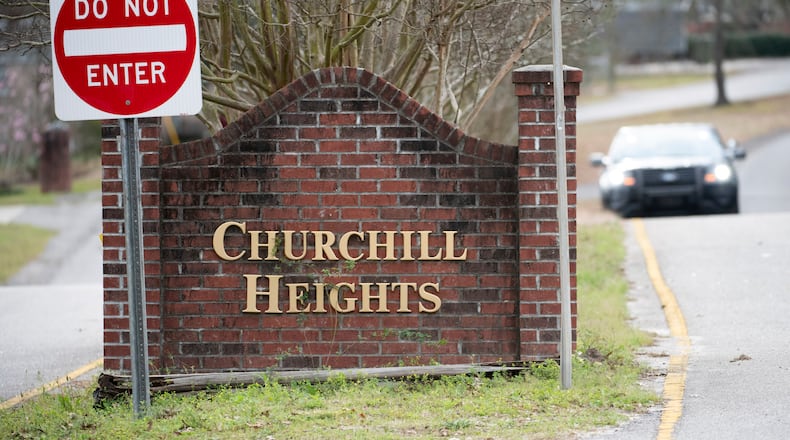 A police officer blocks a road near an entrance to the Churchill Heights neighborhood Thursday, Feb. 13, 2020, in Cayce, S.C., where 6-year-old Faye Marie Swetlik recently went missing just after getting off a school bus. Hundreds of officers in Cayce, along with state police and FBI agents, are working around the clock to try to find Swetlik, who was last seen Monday, Cayce Public Safety Officer Sgt. Evan Antley reiterated Thursday. (AP Photo/Sean Rayford)