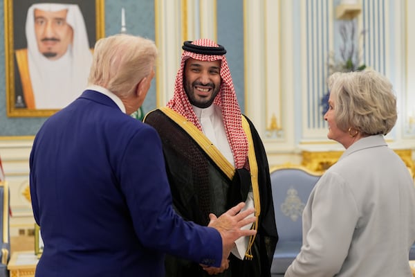 President Donald Trump, left, Saudi Crown Prince Mohammed bin Salman, center, and White House Chief of Staff Susie Wiles speak at the Royal Palace in Riyadh, Saudi Arabia, Tuesday, May 13, 2025. (AP Photo/Alex Brandon)