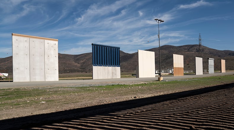 Border wall prototypes stand in San Diego near the Mexico U.S. border, seen from Tijuana, Saturday, Dec. 22, 2018. The U.S. federal government remains partially closed in a protracted standoff over President Donald Trump's demand for money to build a border wall with Mexico.