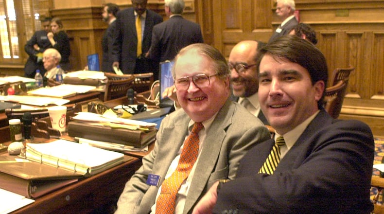 In this AJC file photo from 2000, state Sens. Mike Egan (left) and Clay Land (right) pose to mark their retirement from the Legislature.