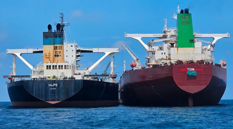 This handout photo from United Against Nuclear Iran shows two oil tankers making a ship-to-ship transfer of Iranian oil in the Eastern Outer Port Limits (EOPL), 70 kilometers off Malaysia's coast in international waters on 28 July 2025. (Charlie Brown/United Against Nuclear Iran via AP)
