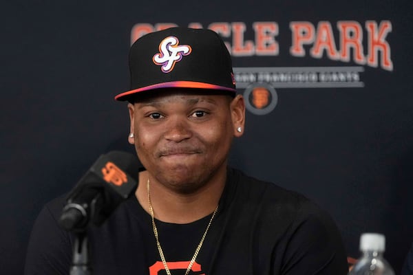 San Francisco Giants' Rafael Devers speaks at a news conference before a baseball game against the Cleveland Guardians in San Francisco, Tuesday, June 17, 2025. (AP Photo/Jeff Chiu)