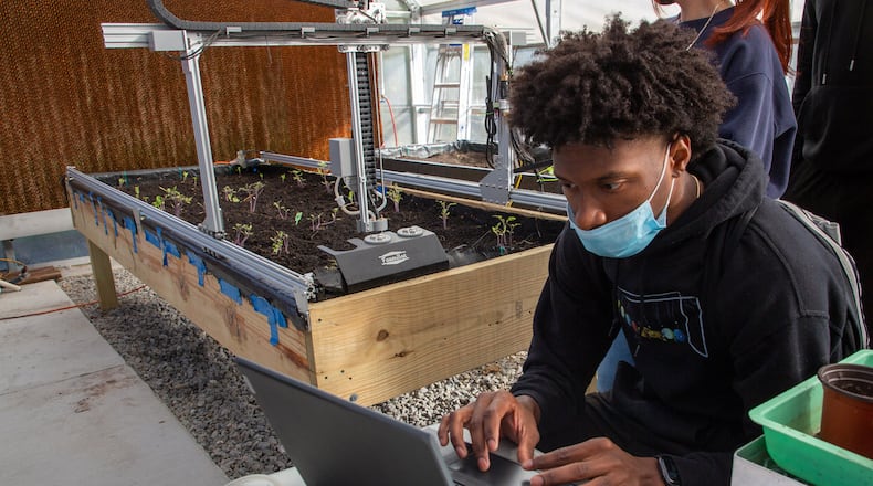 Archer High School student Sean Patterson programs the school's Farm Bot during class Monday, November 8, 2021 STEVE SCHAEFER FOR THE ATLANTA JOURNAL-CONSTITUTION