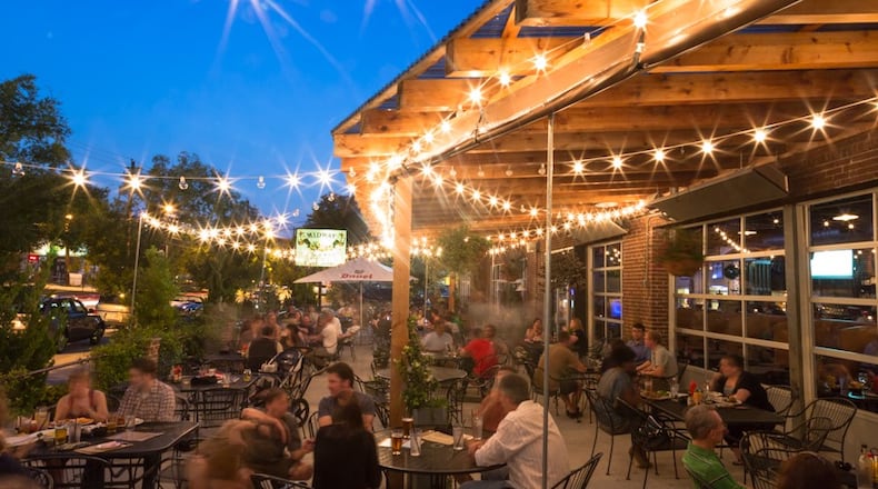 Midway Pub, 552 Flat Shoals Avenue, Atlanta. 404-584-0335, www.themidwaypub.com. Midway Pub in East Atlanta Village has long been a dog-friendly destination. Where dogs once had to hang out on the perimeter of the patio, they are now welcomed inside to join their pet parents as they enjoy the wide selection of beers and pub food. / Photo by Amy Sinclair