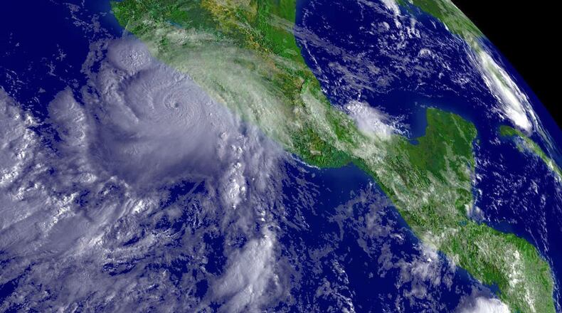 IN SPACE - AUGUST 30: In this satellite image provided by the National Oceanic and Atmospheric Administration, Hurricane John is shown at 10:15am EDT southwest of Mexico's coast August 30, 2006. (Photo by NOAA via Getty Images)