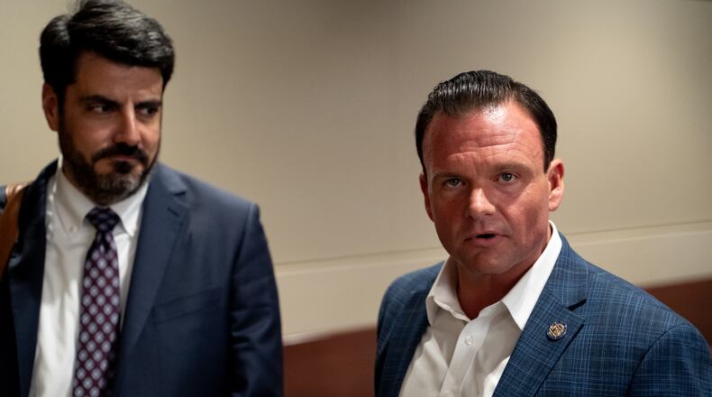 State Senator Clint Dixon (right) gives his reaction to the media. Supporters and opponents have convened for an emergency hearing to consider arguments regarding the proposed creation of the City of Mulberry.Thursday, May 16, 2024 (Ben Hendren for the Atlanta Journal Constitution)