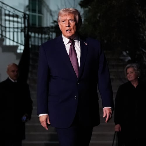 President Donald Trump walks to speak with reporters while departing the White House as chief of staff Susie Wiles, right, looks on, Friday, Dec. 19, 2025, in Washington. (AP Photo/Julia Demaree Nikhinson)