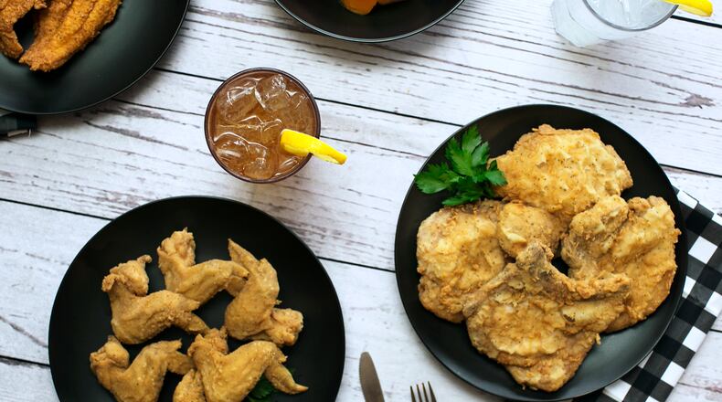 Chicken wings, iced tea, fried chicken and a pork chop are among the Southern classics at Busy Bee Cafe. Photo Courtesy of Morgen Purcell/Lemon Brands