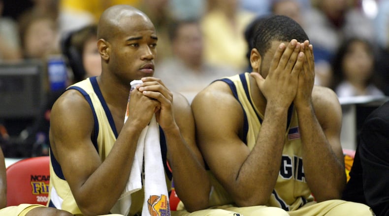 Georgia Tech's Jarrett Jack (left) and B.J. Elder sit dejected on the bench in the second half of their national championship loss to UConn Monday, April 5, 2004, at the Alamodome in San Antonio.