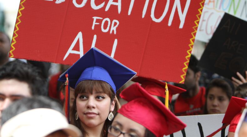 Dozens of DREAMers, most of them Deferred Action beneficiaries and together with members of Georgia Undocumented Youth Alliance (GUYA) rallied in April 2014 at the University of Georgia in Athens. They tried to convince UGA president Jere Morehead to intercede for them and act against state policies denying them enrollment in the university. (Miguel Martinez, MUNDO HISPANICO)