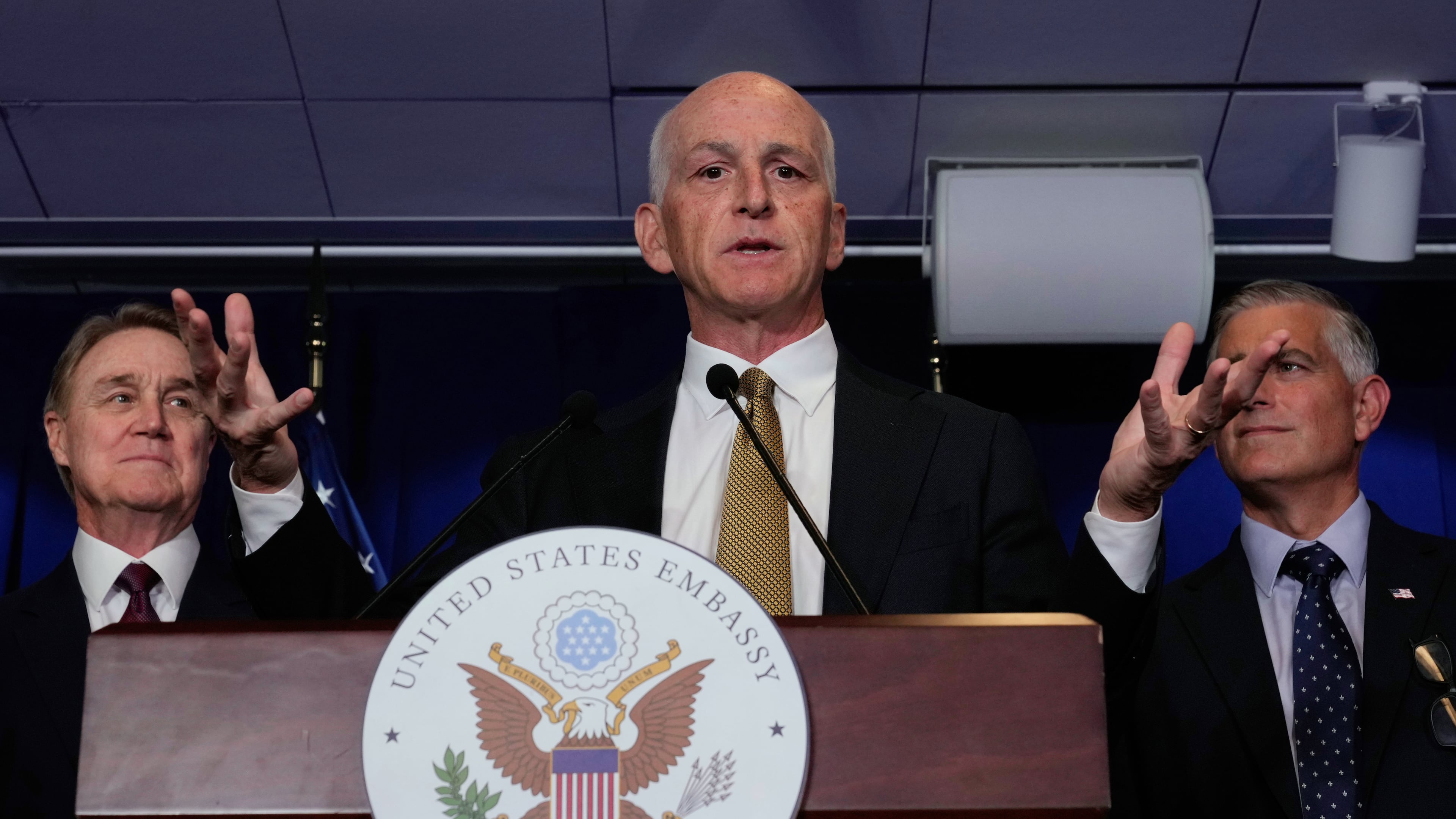 U.S. Rep. Adam Smith, D-Wash, center, speaks during a press conference at the U.S. Embassy in Beijing, China, Tuesday, Sept. 23, 2025. (AP Photo/Mahesh Kumar A.)