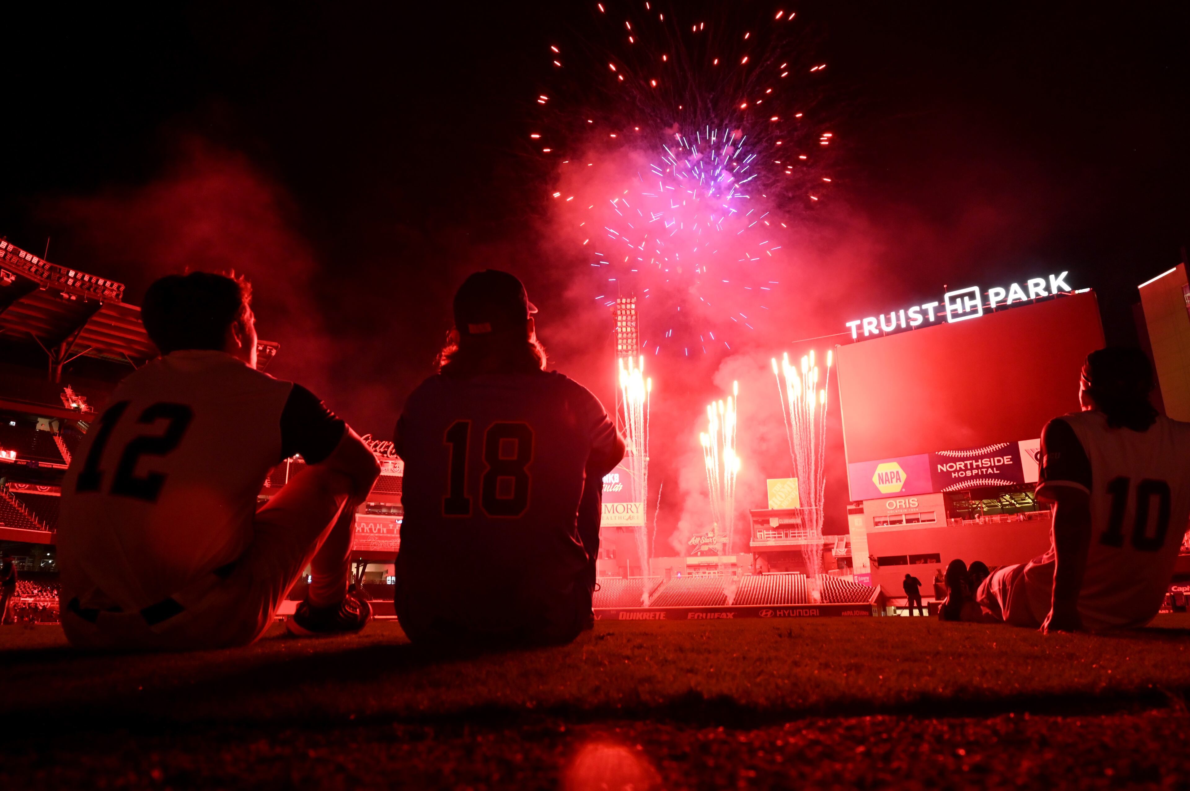 Baseball players watch the fireworks show after the HBCU Swingman Classic game at Truist Park, Friday, July 11, 2025, in Atlanta. National League won 7-4 over American League. (Hyosub Shin / AJC)