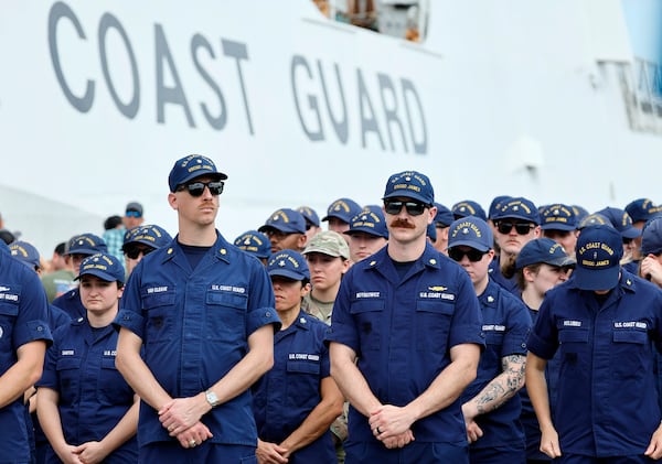 Members of the U.S. Coast Guard from U.S. Coast Guard cutter James await the arrival of U.S. Attorney General Pam Bondi and FBI Director Kash Patel for a news conference on Wednesday, April 9, 2025, at Port Everglades, Fla. (Amy Beth Bennett /South Florida Sun-Sentinel via AP)