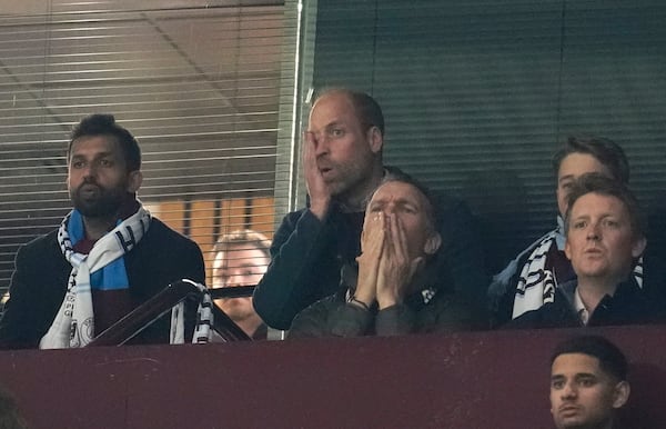 Britain's Prince William, centre top, reacts during the Champions League quarterfinal second leg soccer match between Aston Villa and Paris Saint-Germain at the Villa Park stadium, in Birmingham, England, Tuesday, April 15, 2025. (David Davies/PA via AP)