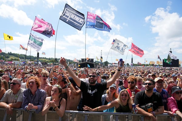 Festivalgoers during the Glastonbury Festival in Worthy Farm, Somerset, England, Friday, June 27, 2025. (Scott A Garfitt/Invision/AP)