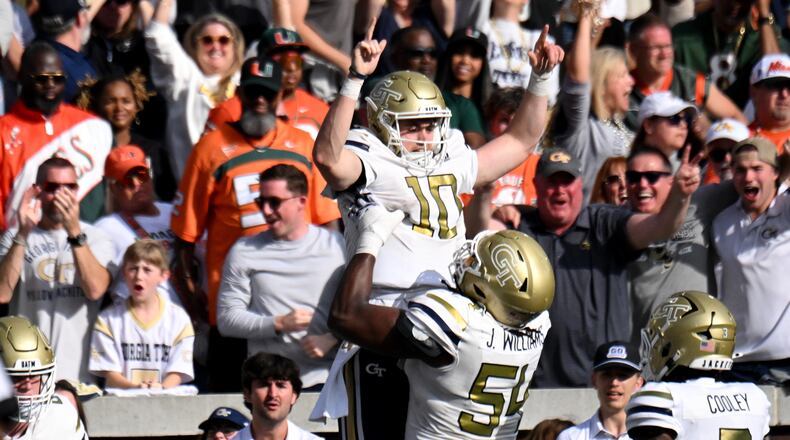Georgia Tech quarterback Haynes King (10) celebrates with Georgia Tech offensive lineman Jordan Williams (54) after scoring a touchdown during the second half of an NCAA college football game at Georgia Tech's Bobby Dodd Stadium, Saturday, November 9, 2024, in Atlanta. Georgia Tech won 28-23 over Miami. (Hyosub Shin / AJC)