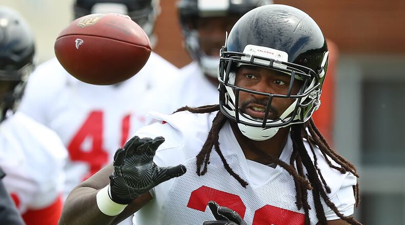 Atlanta Falcons safety Kemal Ishmael catches a ball while running a drill during team practice on Tuesday, June 5, 2018, in Flowery Branch.