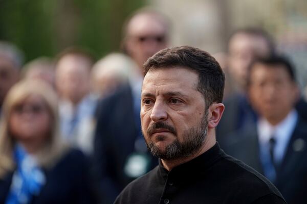 President Volodymyr Zelenskyy answers journalists' questions near a house destroyed by Thursday's Russian strike on a residential neighborhood in Kyiv, Ukraine, on Friday, April 25, 2025. (AP Photo/Evgeniy Maloletka)