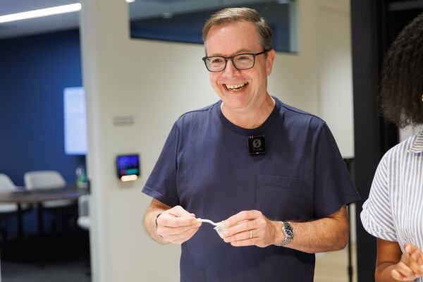 Contributing writer Sam Flemming (aka @punkfoodie.atl) smiles during the “Best Banana Bread Pudding” video shoot for the AJC in Atlanta on Wednesday, Aug. 5, 2026. (Estela Muñoz/AJC) 