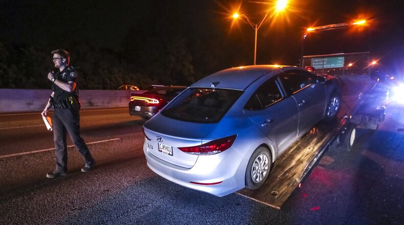 Atlanta police cleared the scene of a crash and shooting investigation on I-20 between Langhorn Street and Joseph E. Lowery Boulevard on the morning of May 6, 2020, after a man flagged down the officers, telling them that bullets went through his vehicle and hit him in the back. JOHN SPINK/JSPINK@AJC.COM