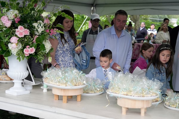 Guests arrive on the South Lawn of the White House before President Donald Trump and first lady Melania Trump participate in the White House Easter Egg Roll Monday, April 21, 2025, in Washington. (AP Photo/Alex Brandon)