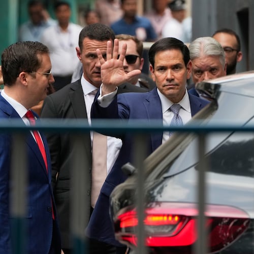 U.S. Secretary of State Marco Rubio, center, waves to the media as he comes out after a visit at Mother House, the headquarters of the Missionaries of Charity in Kolkata, India, Saturday, May 23, 2026. (AP Photo/Bikas Das)