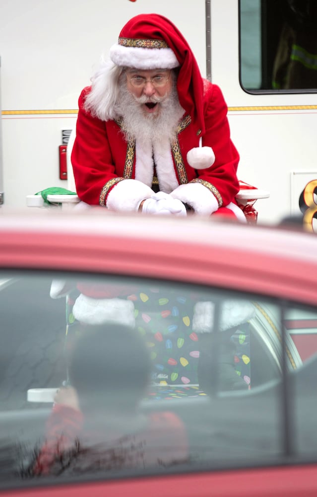 Santa near an Alpharetta Fire Truck