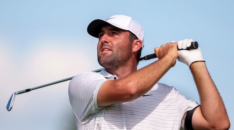Scottie Scheffler hits his tee shot on the ninth hole during the third round of the Tour Championship golf tournament, Saturday, Aug. 31, 2024, in Atlanta. (AP Photo/Jason Allen)