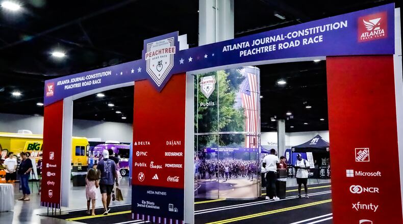 Runners arrive at the 2023 Peachtree Health and Fitness Expo at the Georgia World Congress Center in Atlanta.