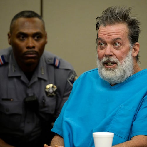 FILE - Robert Dear talks to Judge Gilbert Martinez during a court appearance in Colorado Springs, Colo., on Dec. 9, 2015. (Andy Cross/The Denver Post via AP, Pool, File)