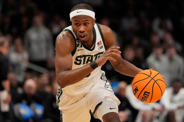 Michigan State guard Tre Holloman (5) drives against Mississippi during the first half in the Sweet 16 of the NCAA college basketball tournament, Friday, March 28, 2025, in Atlanta. (AP Photo/Brynn Anderson)