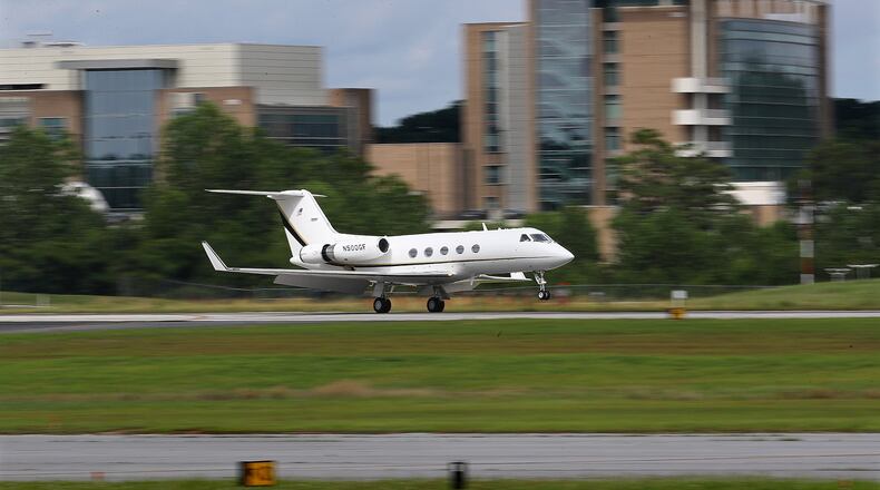 A plane lands at DeKalb-Peachtree Airport on Monday.