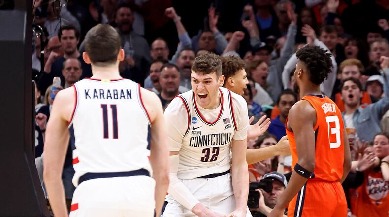 Connecticut Huskies center Donovan Clingan (32) celebrates his bucket as UConn takes on Illinois in the NCAA Men’s East Regional basketball playoffs at TD Garden on Saturday, March 30, 2024, in Boston. (Stuart Cahill/Boston Herald/TNS)