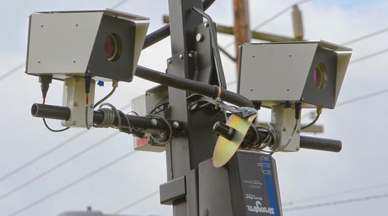 Automated speed cameras similar to these will begin monitoring school zones in Duluth. (AJC File)