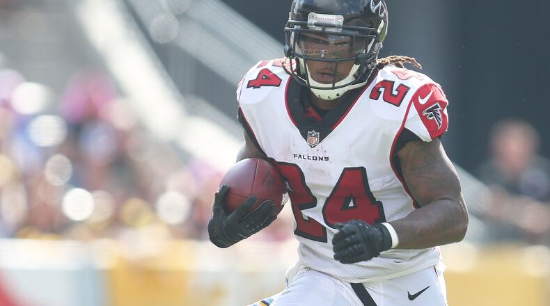 Atlanta Falcons running back Devonta Freeman (24) rushes the ball against the Pittsburgh Steelers during the second quarter at Heinz Field.