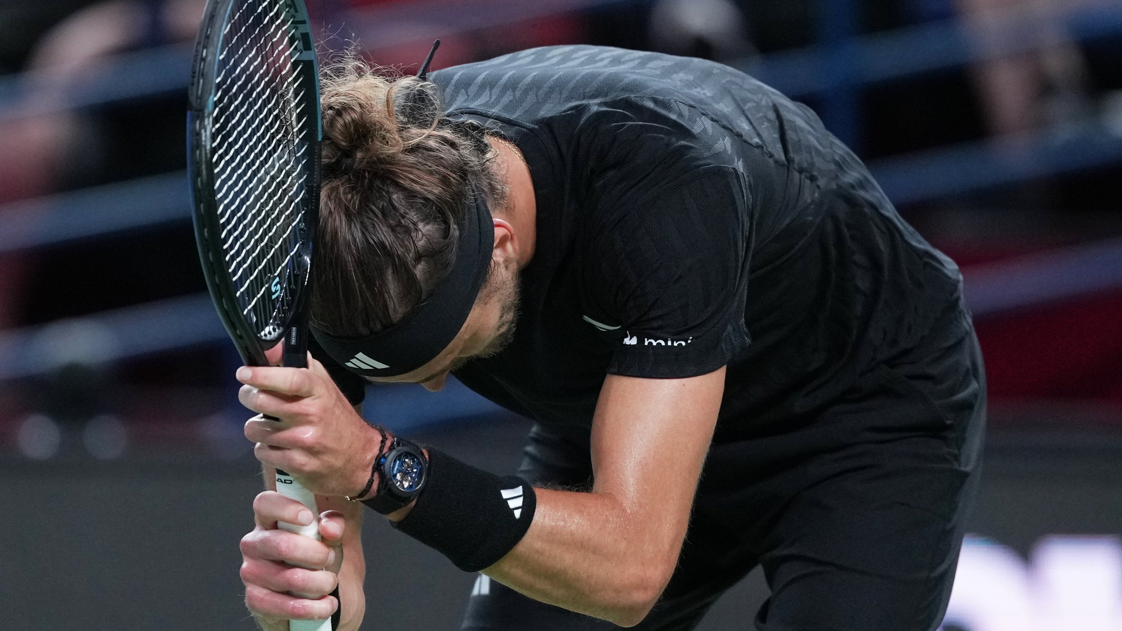 Alexander Zverev of Germany reacts after losing a point to Arthur Rinderknech of France during the men's singles match of the Shanghai Masters tennis tournament at Qizhong Forest Sports City Tennis Center, in Shanghai, China, Monday, October. 6, 2025. (AP Photo/Andy Wong)
