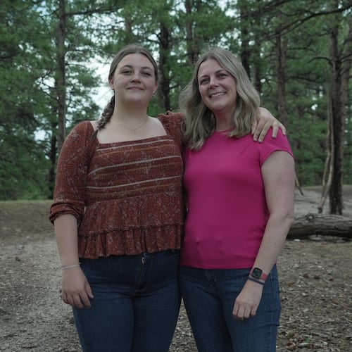 Charlotte Touzalin stands with her mother, Anne Schultz, Friday, July 10, 2026 in Elizabeth, Colo. (AP Photo/Brittany Peterson)