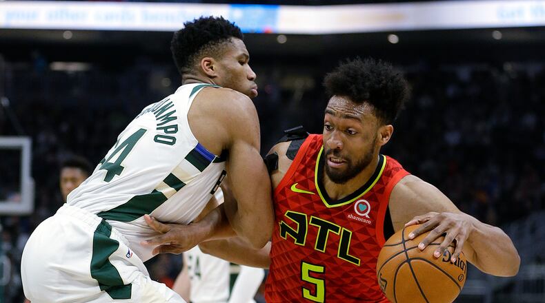 Hawks' Jabari Parker drives to the basket against Milwaukee Bucks' Giannis Antetokounmpo. (AP Photo/Aaron Gash)
