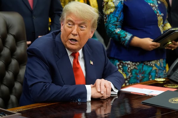 President Donald Trump answers questions from reporters as he meets with Congo's Foreign Minister Therese Kayikwamba Wagner, and Rwanda's Foreign Minister Olivier Nduhungirehe, Friday, June 27, 2025, in the Oval Office at the White House in Washington. (AP Photo/Manuel Balce Ceneta)