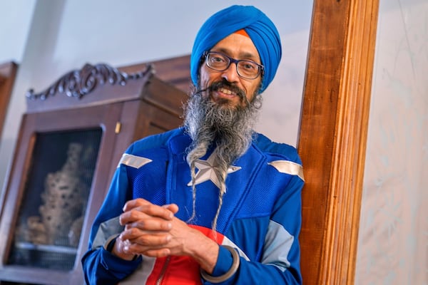 Vishavjit Singh, who educates youth about Sikhism through his Captain Sikh America character, poses for a portrait in costume at home, in New York's Harlem neighborhood, Friday, May 30, 2025. (AP Photo/Richard Drew)