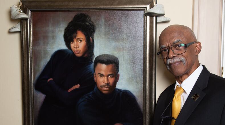 Portrait of Tom Dorsey with a painting he did of his children Scott & Carol in his Atlanta home. He made a name for himself with his photographs of well-known African American families, but his focus is now on young black teen males who don’t have good family role models. The 82-year-old has been mentoring teens since 2007, and is still at it, constantly working out his program and asking other men to come help. (Photo by Phil Skinner)