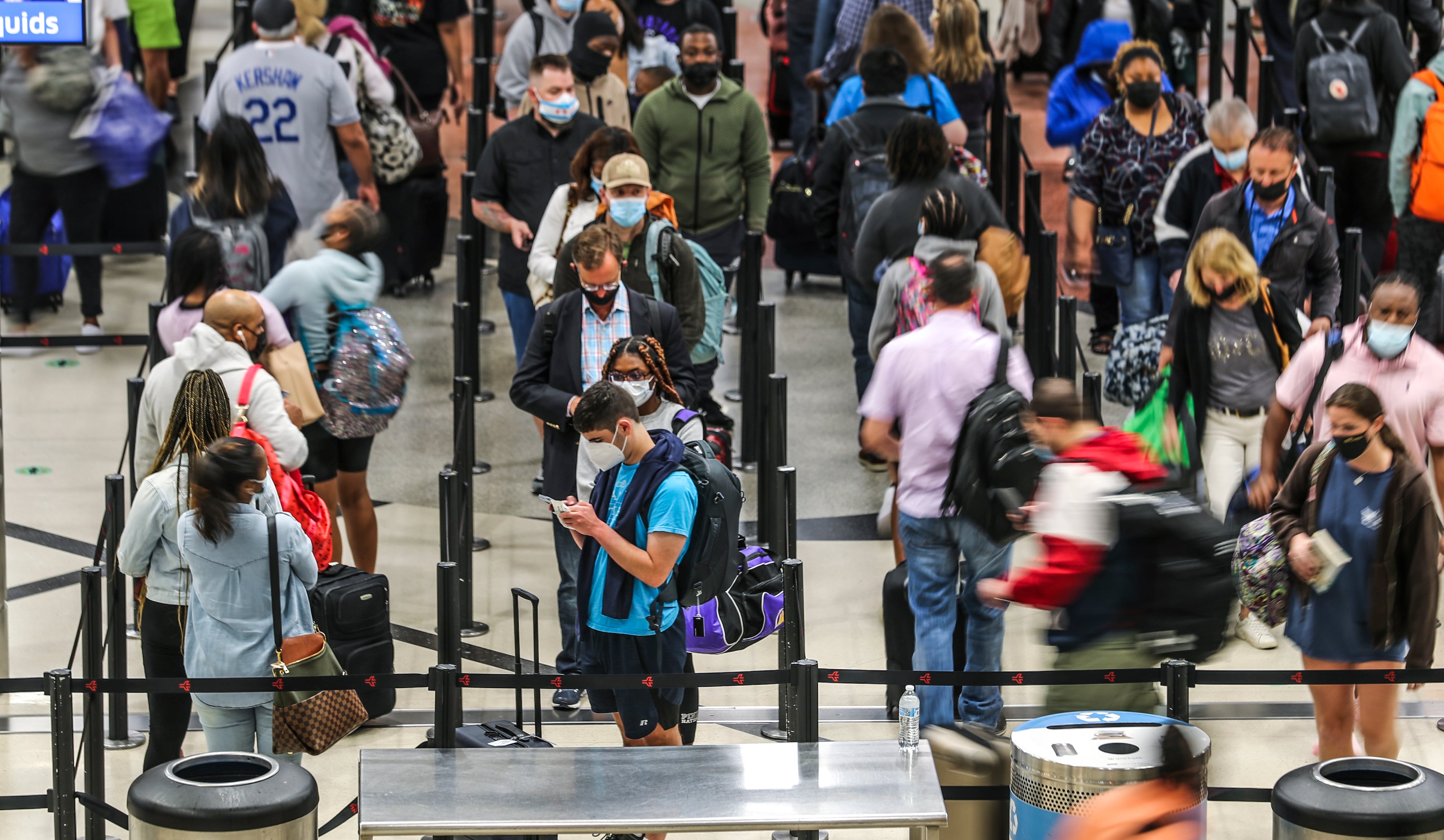 The main security checkpoint was full once again as lines at Hartsfield-Jackson International Airport stretched through the domestic terminal atrium and down hallways early Monday morning, May 17, 2021 as travel ramps up in a recovery from the effects of COVID-19. (John Spink / AJC file)
