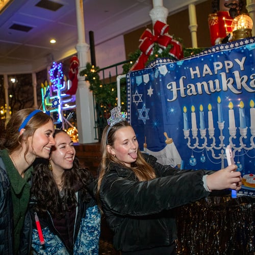 Congregation Ner Tamid hosts a menorah lighting on the fifth night of Hanukkah in Marietta Square on Saturday, Dec 28, 2024. The Kennesaw-based temple will host a menorah lighting for the 11th time in the square this year. (Jenni Girtman for the AJC)