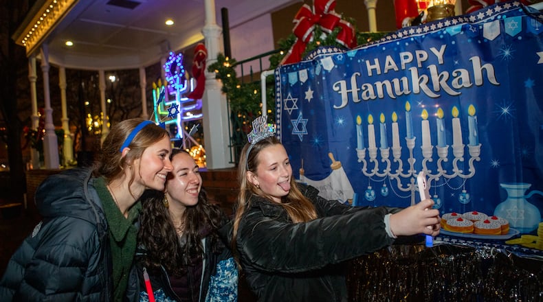Congregation Ner Tamid hosts a menorah lighting on the fifth night of Hanukkah in Marietta Square on Saturday, Dec 28, 2024. The Kennesaw-based temple will host a menorah lighting for the 11th time in the square this year. (Jenni Girtman for the AJC)