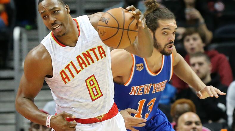 Hawks center Dwight Howard steals from Knicks Joakim Noach in a NBA basketball game on Wednesday, Dec. 28, 2016, in Atlanta. Curtis Compton/ccompton@ajc.com