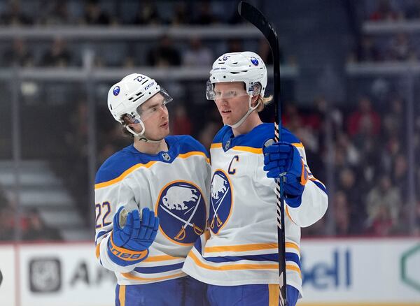 Buffalo Sabres defenceman Rasmus Dahlin (26) celebrates his goal against the Ottawa Senators with right wing Jack Quinn (22) during first period NHL hockey action in Ottawa, on Tuesday, April 1, 2025. (Justin Tang/The Canadian Press via AP)