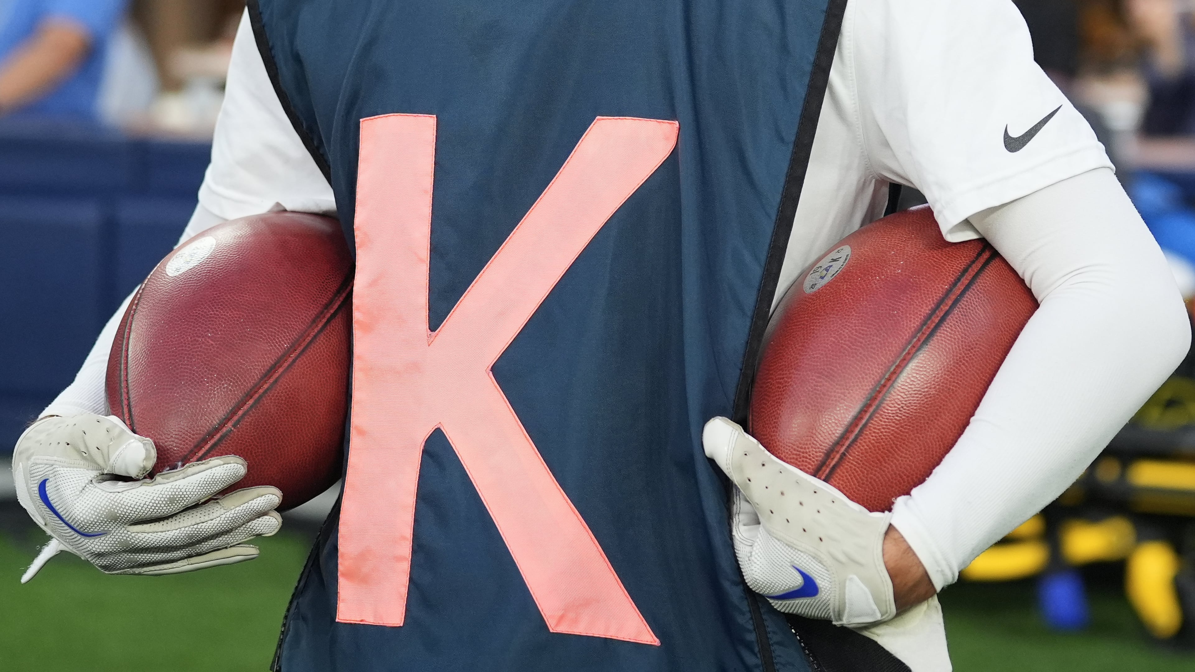 Special footballs used for kicks and punts are held by a ball crew member during the first half of an NFL football game between the Los Angeles Rams and the San Francisco 49ers, Thursday, Oct. 2, 2025, in Inglewood, Calif. (AP Photo/Marcio Jose Sanchez)