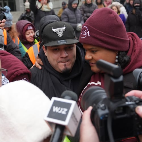 Kilmar Abrego Garcia leaves with Lydia Walther-Rodriguez of Casa in Maryland, after a mandatory check at the Immigration and Customs Enforcement office in Baltimore, Friday, Dec. 12, 2025, after he was released from detention on Thursday under a judge's order. (AP Photo/Stephanie Scarbrough)