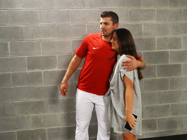 Braves third baseman Austin Riley gets a hug from his wife Anna after his press conference.   “Curtis Compton / Curtis Compton@ajc.com