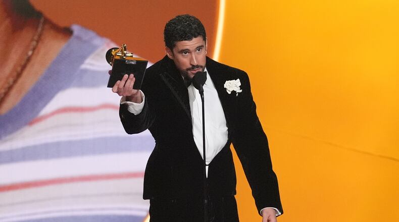 Bad Bunny accepts the award for album of the year for "Debí Tirar Más Fotos" during the 68th annual Grammy Awards on Sunday, Feb. 1, 2026, in Los Angeles. (AP Photo/Chris Pizzello)